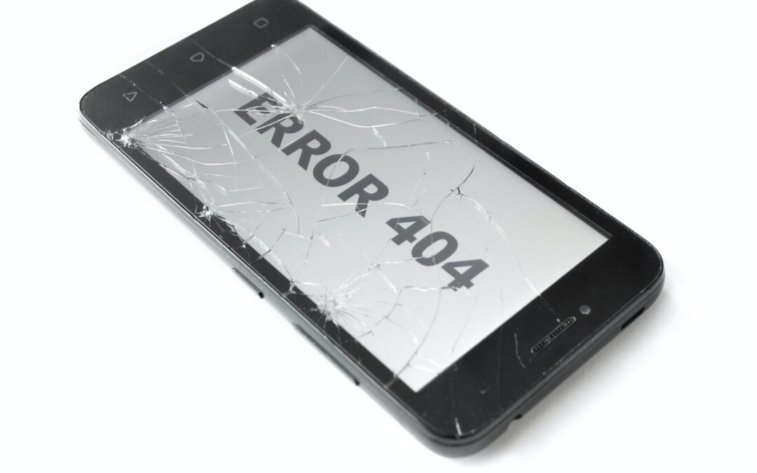 Broken Cell Phone with broken screen and error message. You are a mistake
